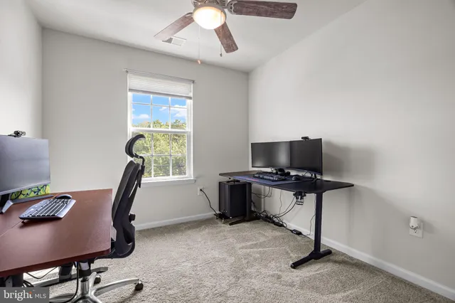a bathroom with a toilet sink vanity and mirror