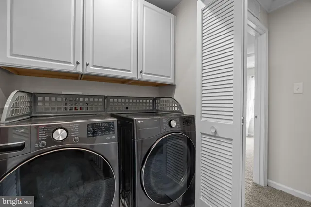 a bedroom with a bed and a chair