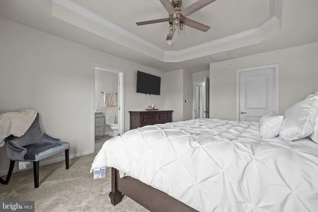 a bathroom with a double vanity sink toilet mirror and shower