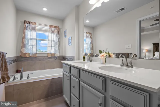 a view of walk in closet with clothes