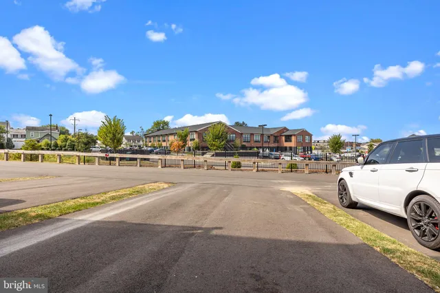 a view of parking area with car parked