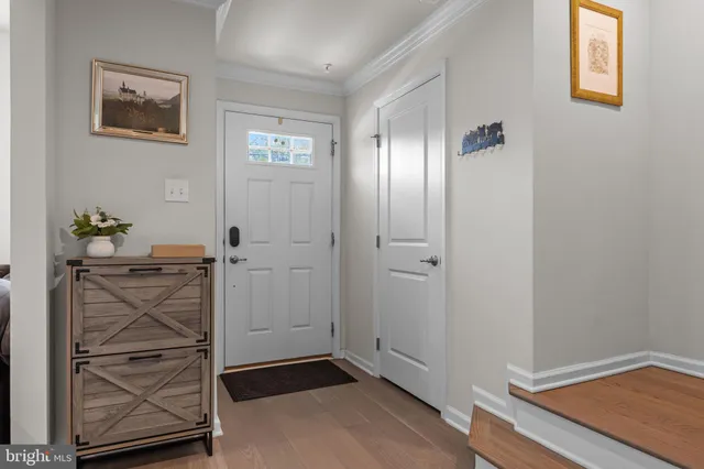 a view of an entryway with wooden floor