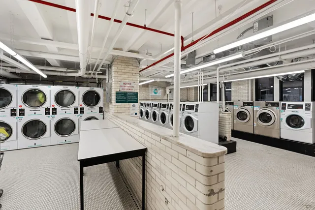 a view of a patio with table and chairs and potted plants