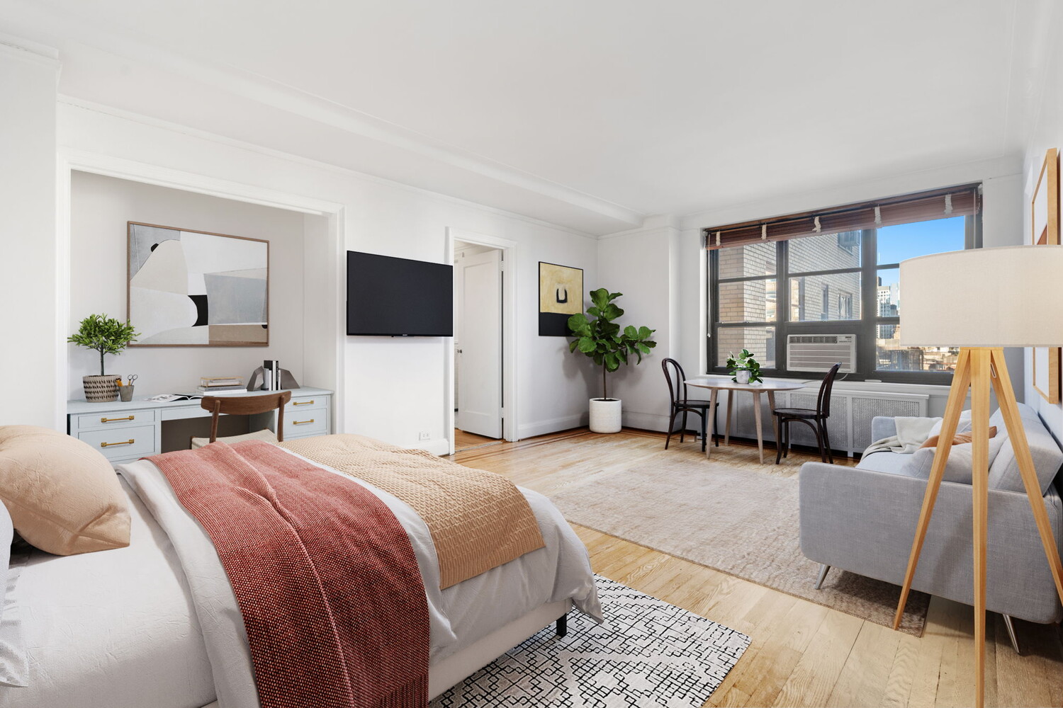 a bedroom with furniture and a flat screen tv