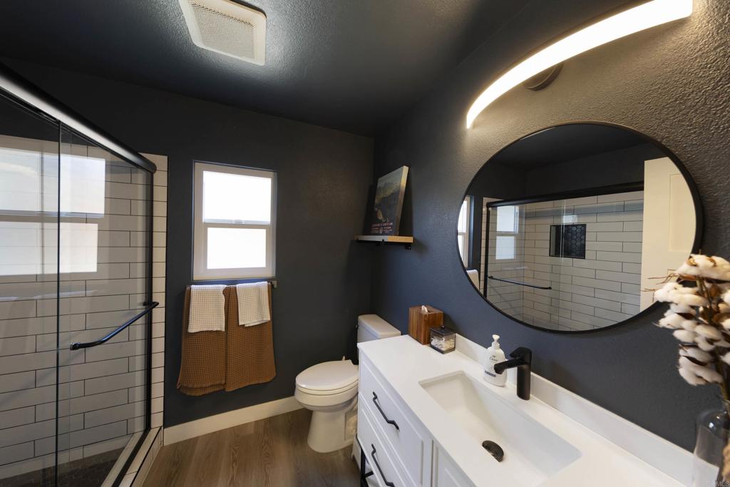 3577 Winslow Road Oceanside, CA 92056 - Photo 17 of 53 a bathroom with a sink a toilet and tub