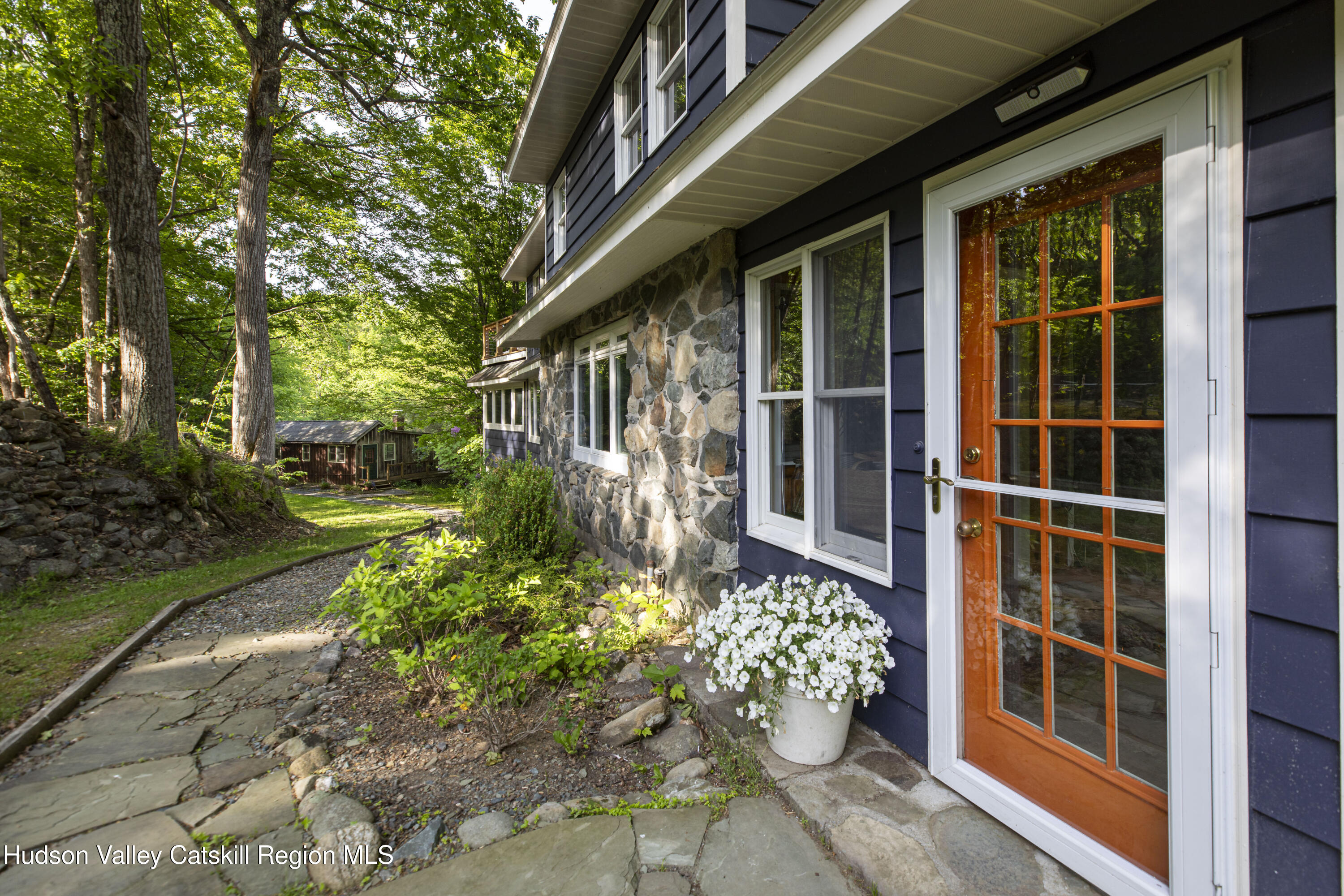 22 Old Mill Road Stephentown, NY 12169 - Photo 5 of 55 a front view of a house with a garden