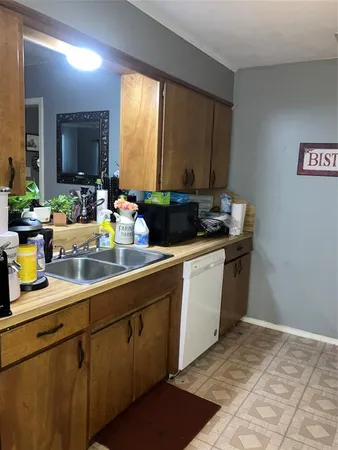 a kitchen with a stove and a refrigerator