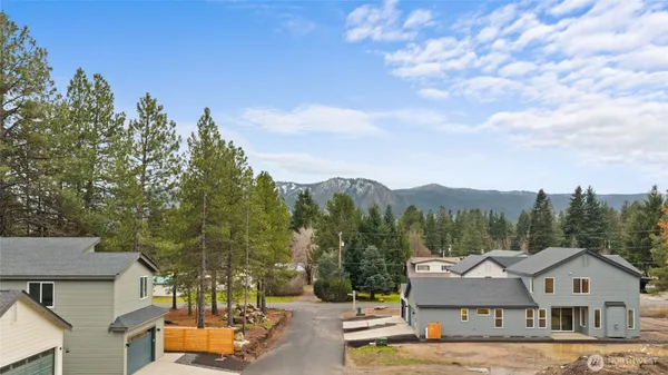 a aerial view of a house with a yard and sitting area