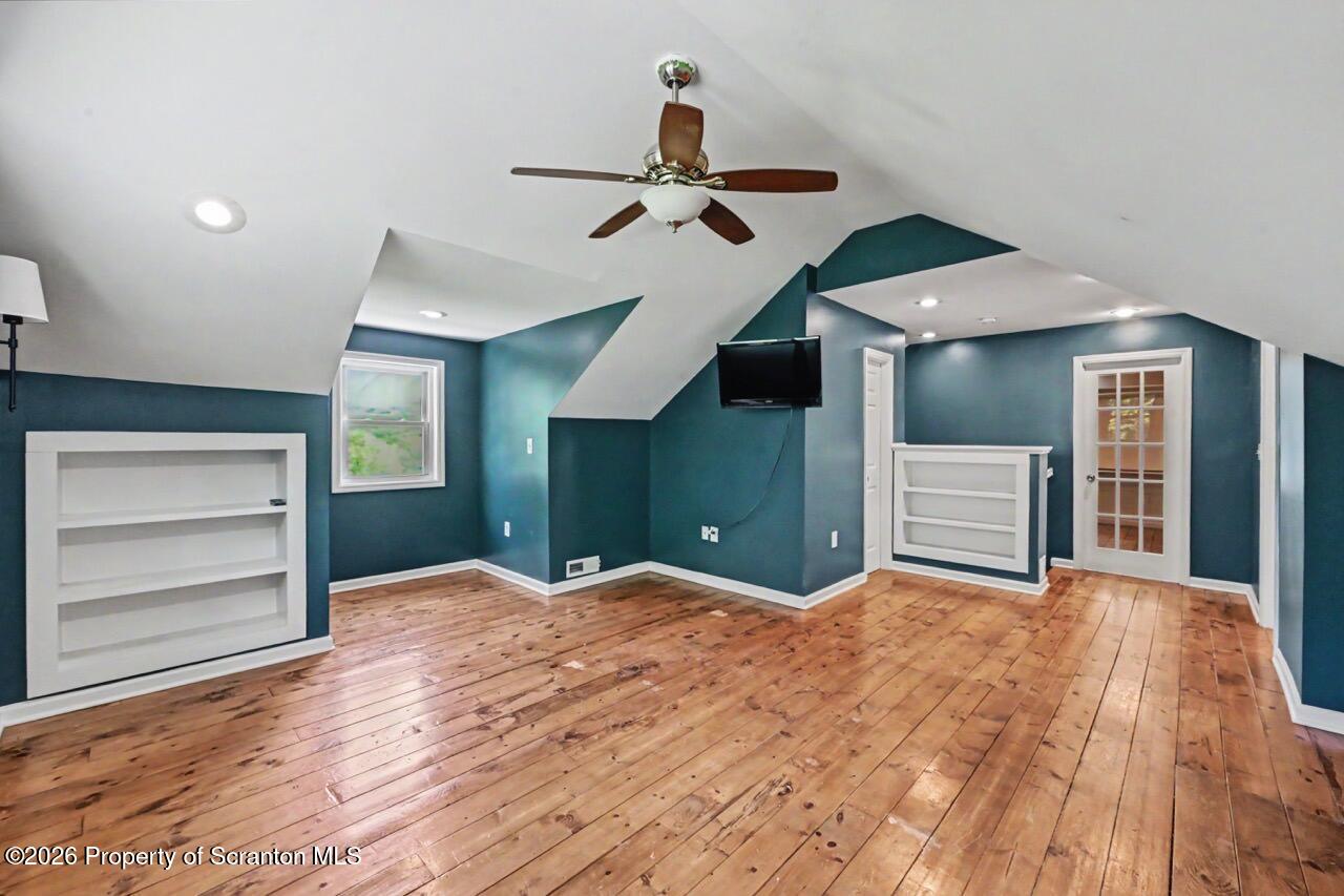 457 Craig Road Dalton, PA 18414 - Photo 77 of 114 a view of empty room with a ceiling fan and window