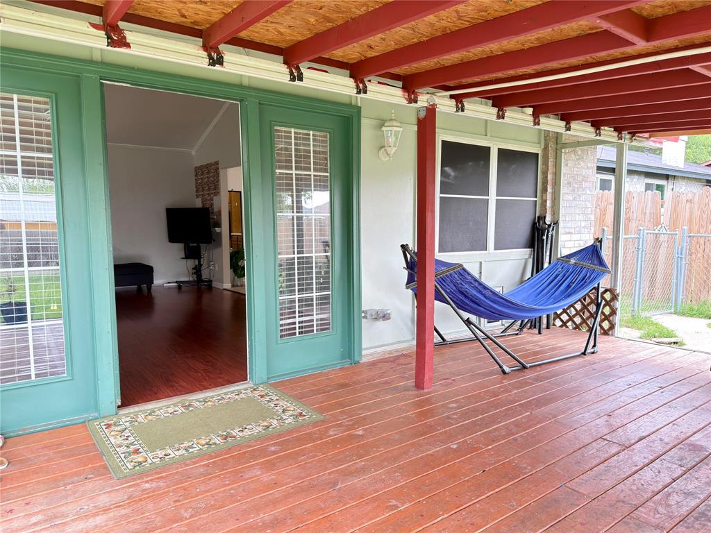 1519 Clearbrook Street Lancaster, TX 75134 - Photo 11 of 29 a view of an outdoor space with porch and wooden floor