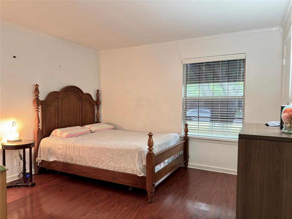 1519 Clearbrook Street Lancaster, TX 75134 - Photo 17 of 29 a bedroom with a bed and a window