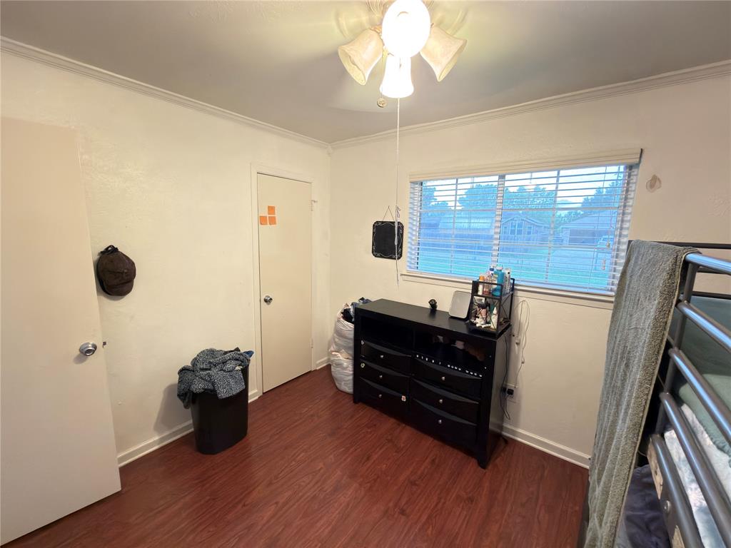 1519 Clearbrook Street Lancaster, TX 75134 - Photo 20 of 29 a room with wooden floor and furniture