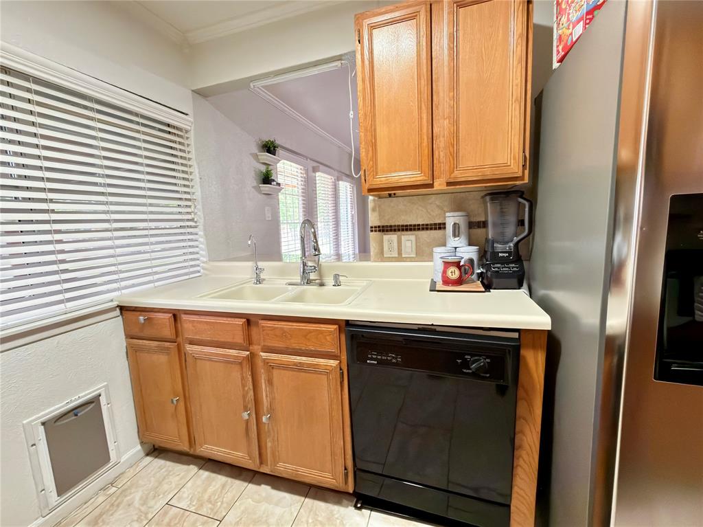 1519 Clearbrook Street Lancaster, TX 75134 - Photo 3 of 29 a utility room with a sink and a window
