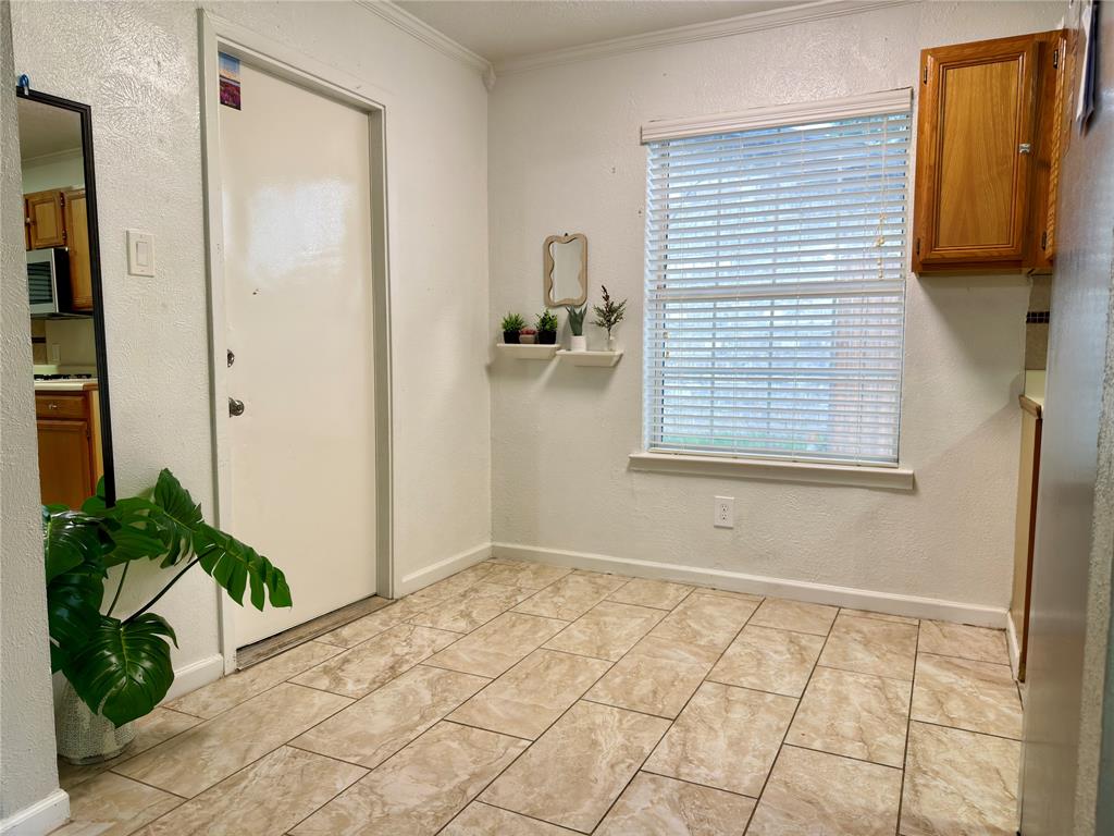 1519 Clearbrook Street Lancaster, TX 75134 - Photo 7 of 29 a view of an empty room and a window