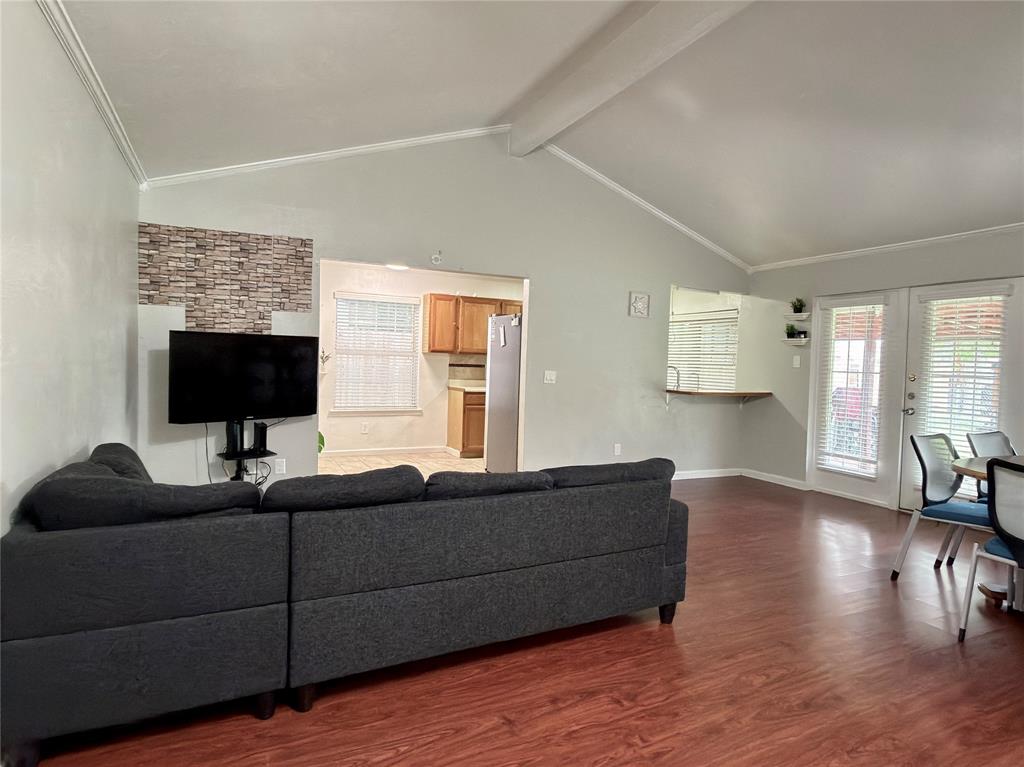 1519 Clearbrook Street Lancaster, TX 75134 - Photo 8 of 29 a living room with furniture and a flat screen tv