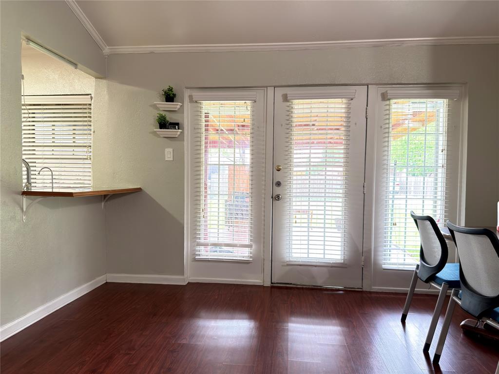 1519 Clearbrook Street Lancaster, TX 75134 - Photo 10 of 29 a view of room with wooden floor and windows