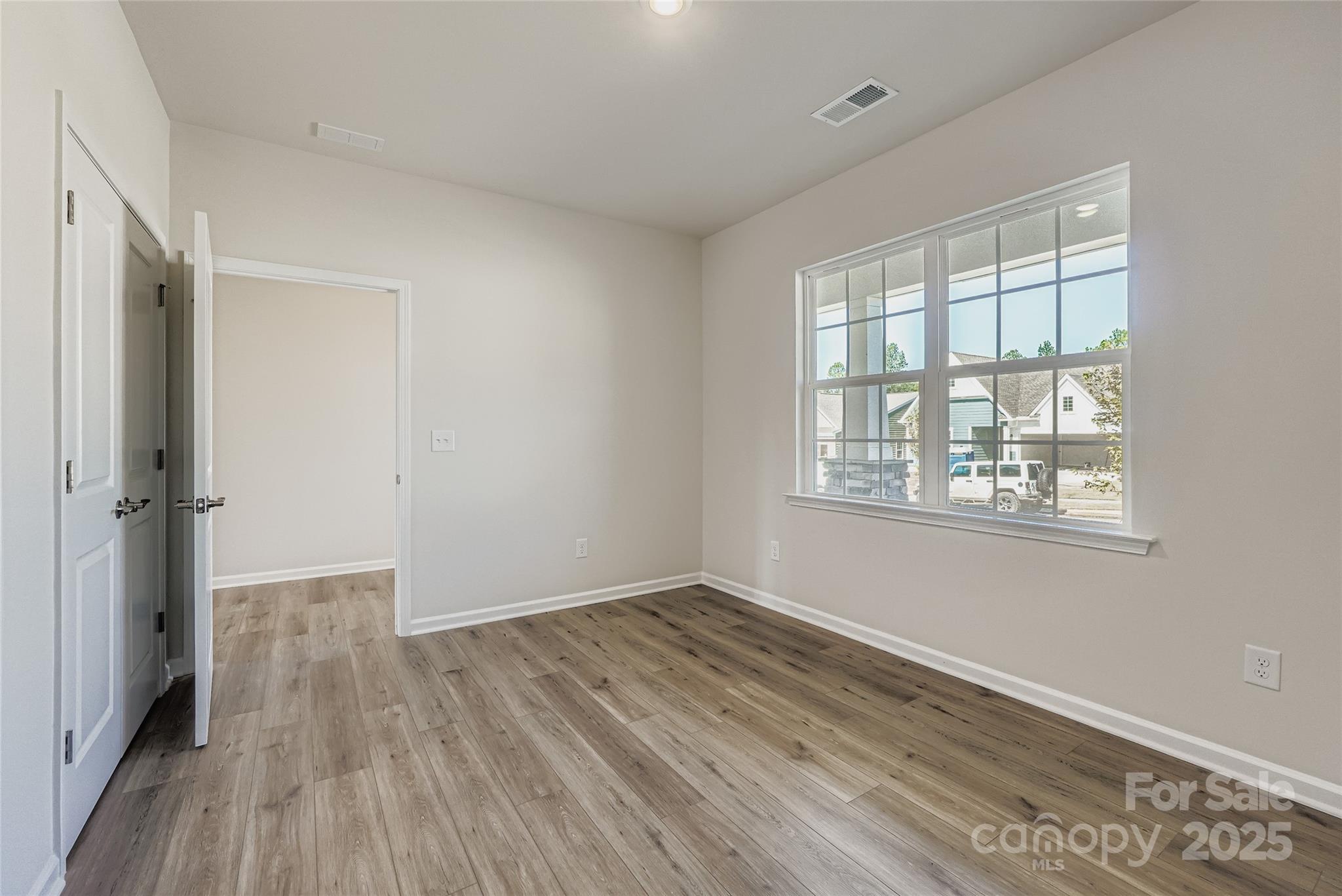 8487 Norman Frst Road Lancaster, SC 29720 - Photo 9 of 16 a view of a room with wooden floor and windows