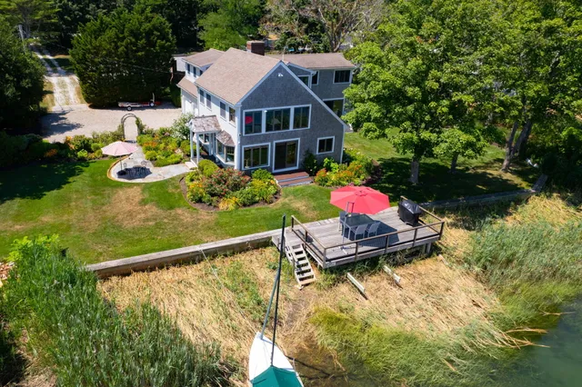 a aerial view of a house with swimming pool and garden