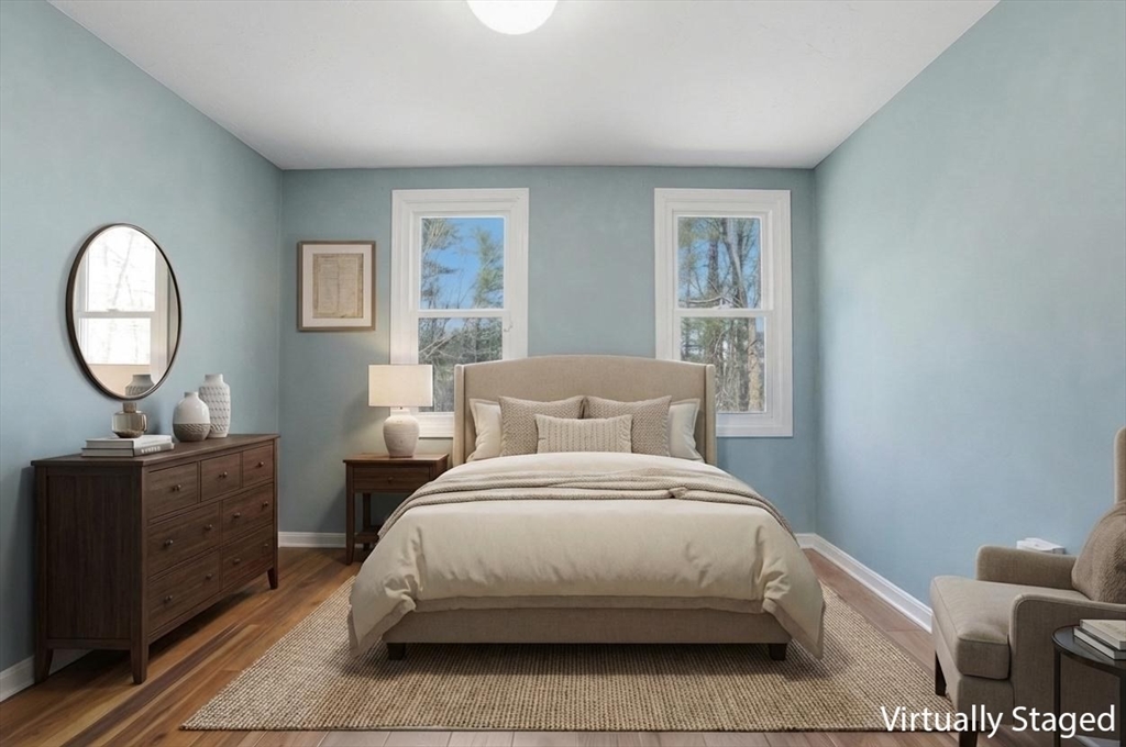 30 Packet Landing, Unit A Pembroke, MA 02359 - Photo 11 of 32 a bedroom with a bed a lamps and a dresser