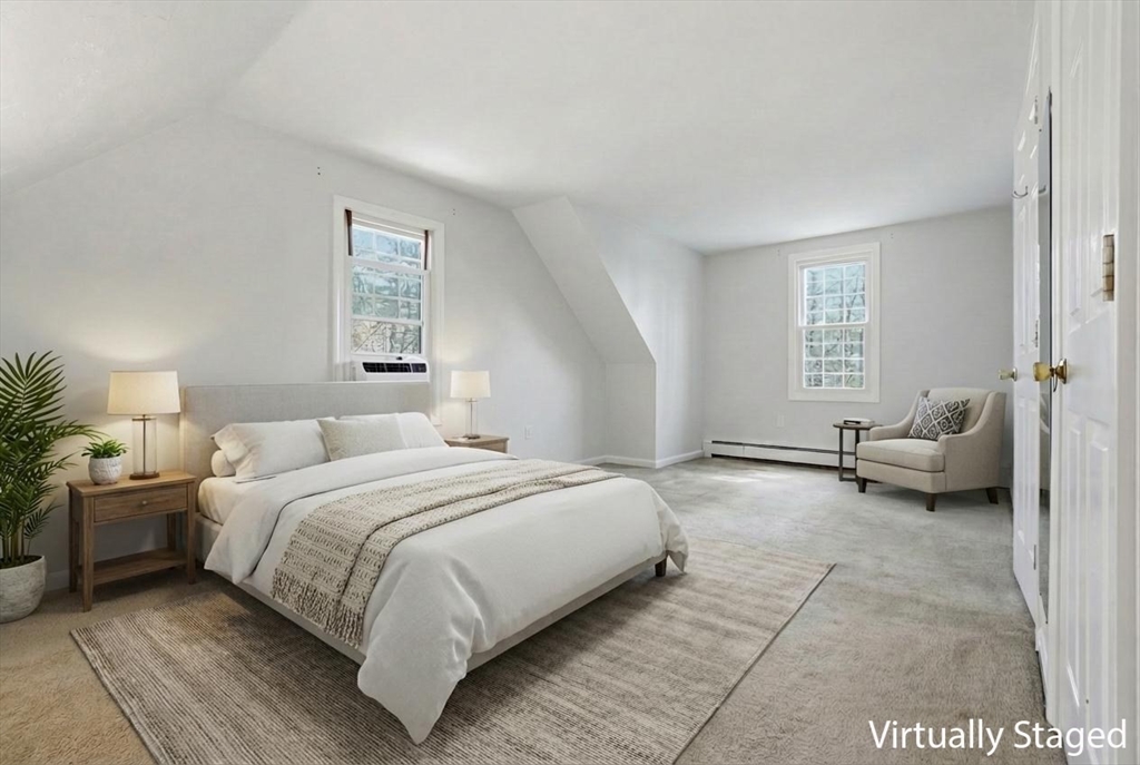 30 Packet Landing, Unit A Pembroke, MA 02359 - Photo 12 of 32 a bedroom with a bed couch and a window