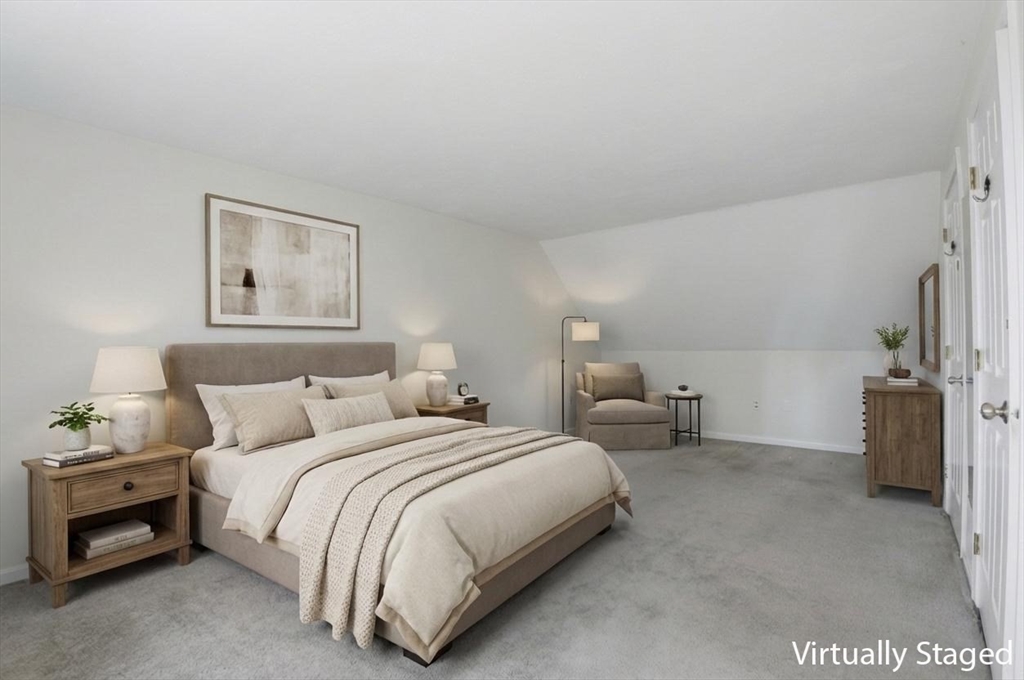 30 Packet Landing, Unit A Pembroke, MA 02359 - Photo 13 of 32 a bedroom with bed and a couch