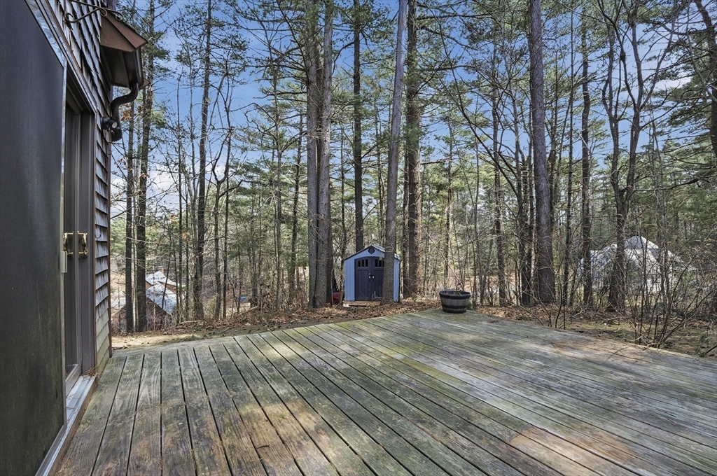 30 Packet Landing, Unit A Pembroke, MA 02359 - Photo 25 of 32 a view of outdoor space with deck and tree