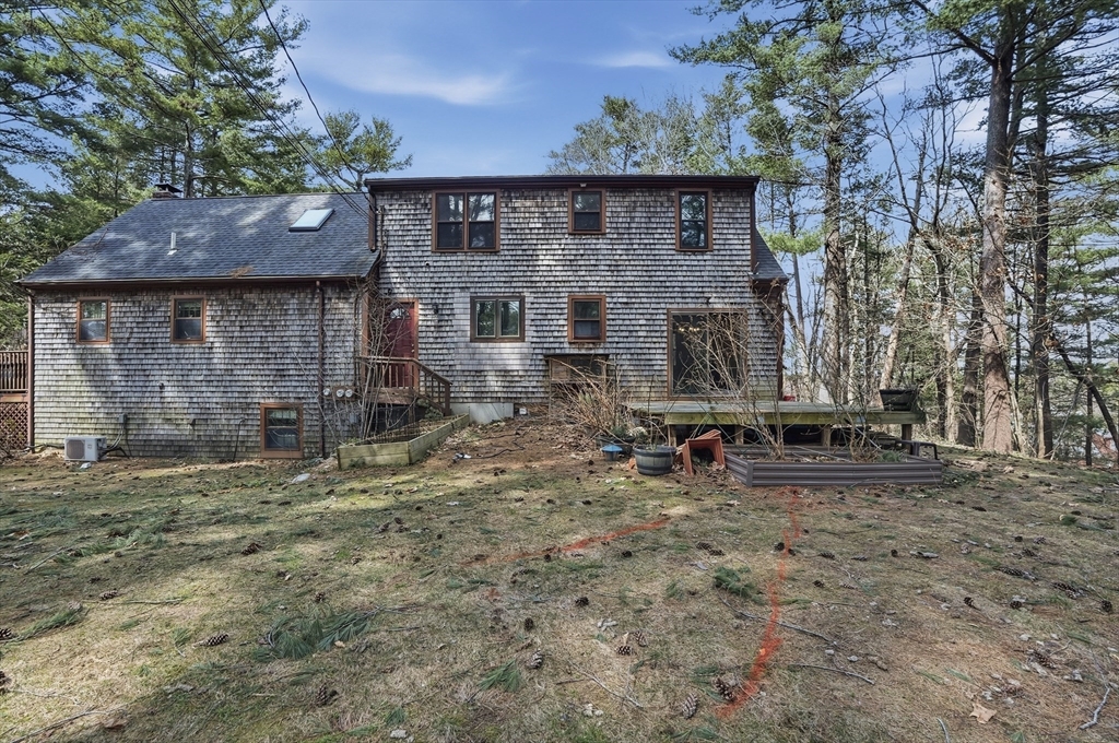 30 Packet Landing, Unit A Pembroke, MA 02359 - Photo 26 of 32 a backyard of a house with wooden fence