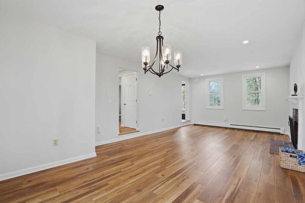 30 Packet Landing, Unit A Pembroke, MA 02359 - Photo 6 of 32 a view of empty room with wooden floor and ceiling fan