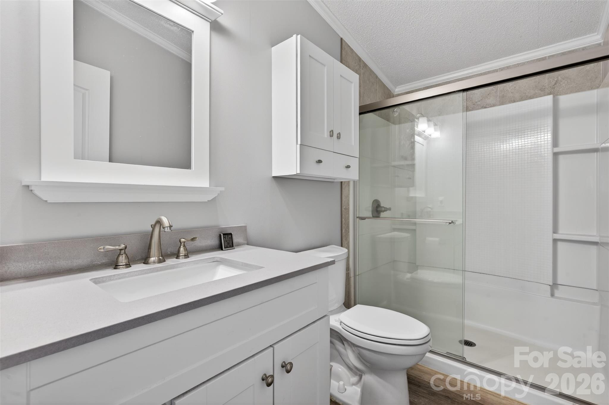 4352 Anderson Mountain Road Maiden, NC 28650 - Photo 27 of 42 a bathroom with a sink toilet and shower
