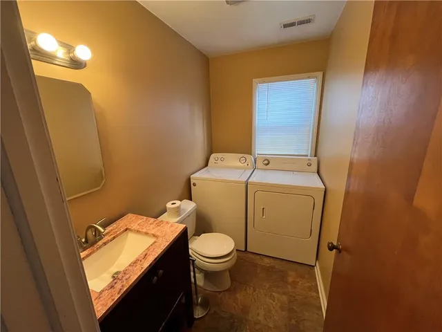 a bathroom with a sink and a toilet