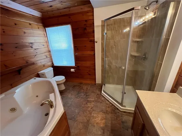 a bathroom with a tub and shower