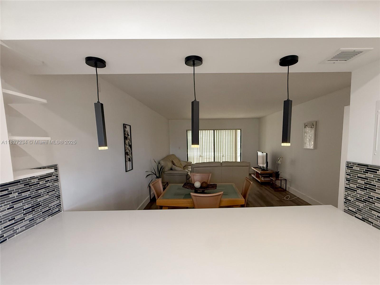 9355 Southwest 8th Street, Unit 402 Boca Raton, FL 33428 - Photo 11 of 29 a bed room with furniture and a window