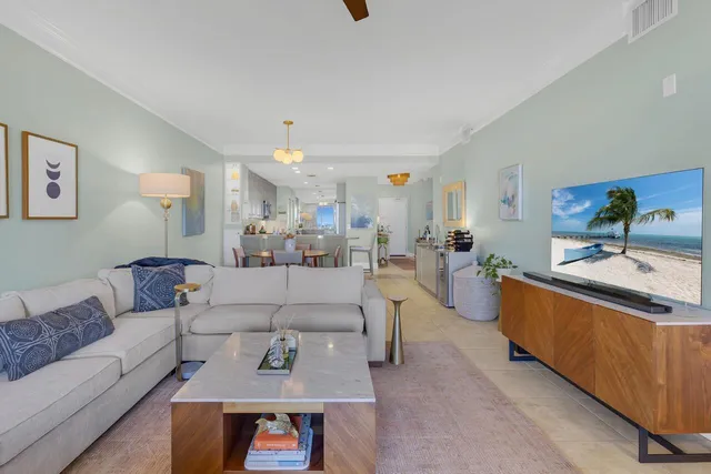 a living room with furniture and a table