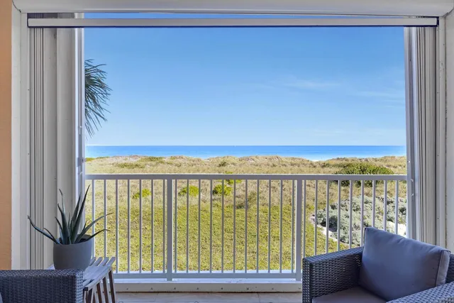 a view of a balcony with furniture