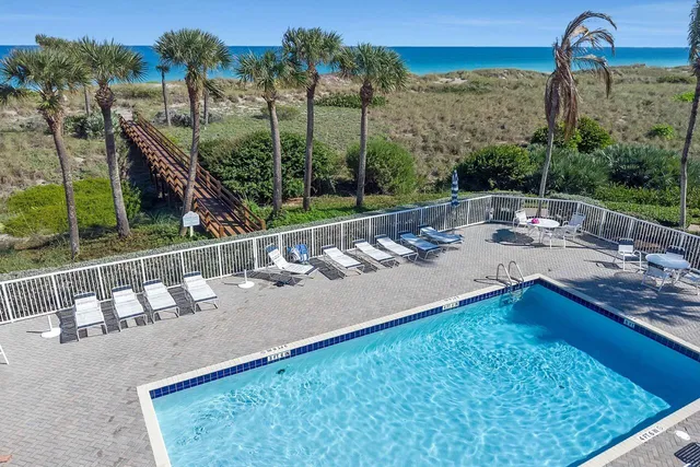 a view of a swimming pool with a patio