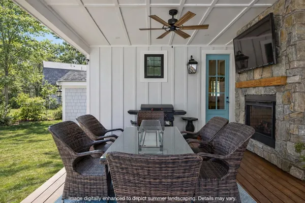 a view of a house with backyard sitting area and garden