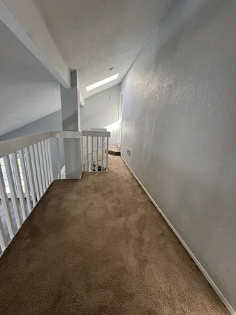 a view of hallway with stairs