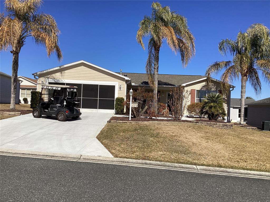 457 Alora Street The Villages, FL 32162 - Photo 1 of 2 a front view of a house with garden