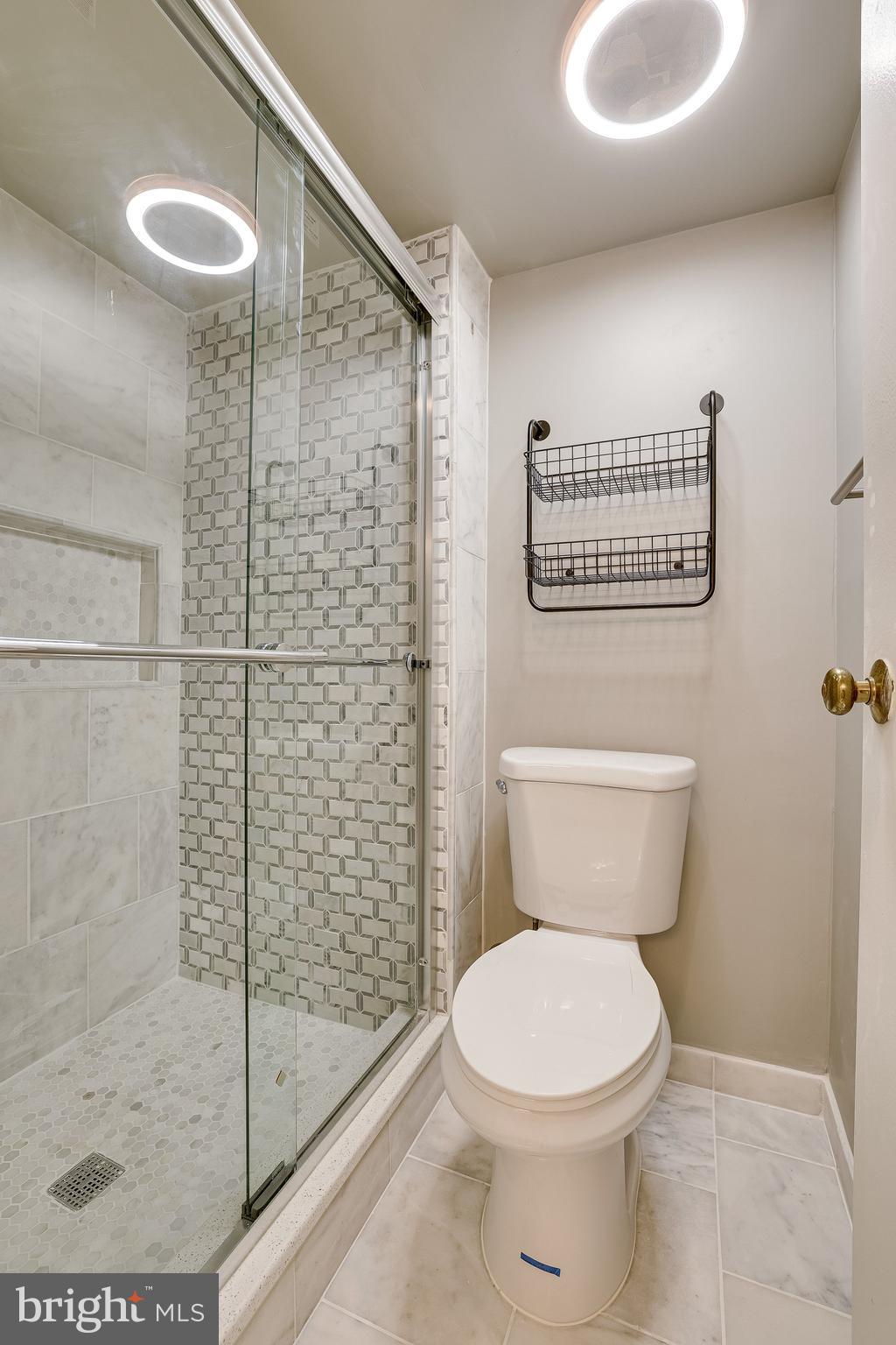 2210 Springwood Drive, Unit 207 Reston, VA 20191 - Photo 19 of 28 Bathroom with sliding glass doors