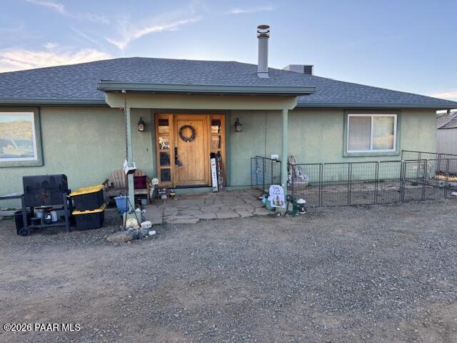 a view of a car park in front of house
