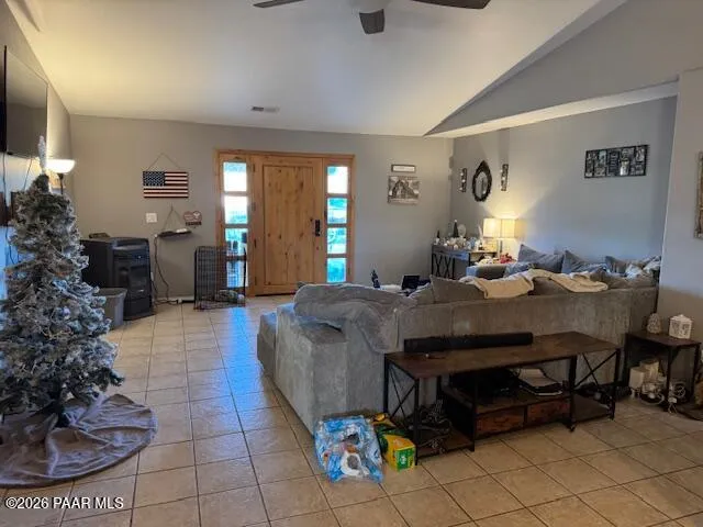 a living room with a couch and a potted plant