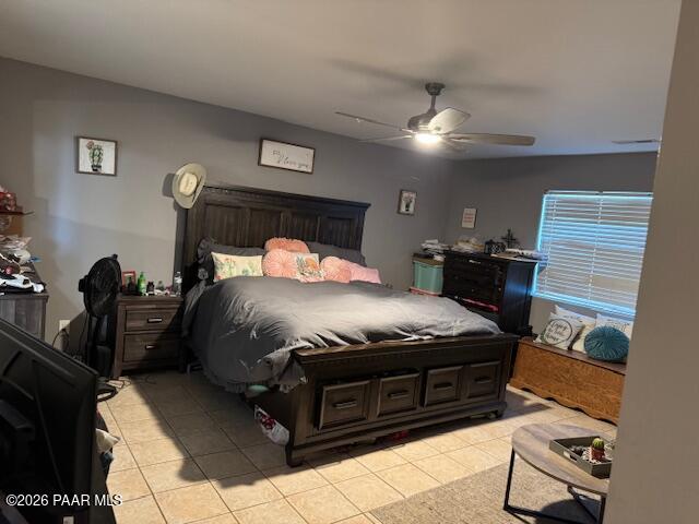 1900 Colors Of The Wind Road, Unit R Dewey, AZ 86327 - Photo 5 of 16 a bedroom with a bed and a chandelier