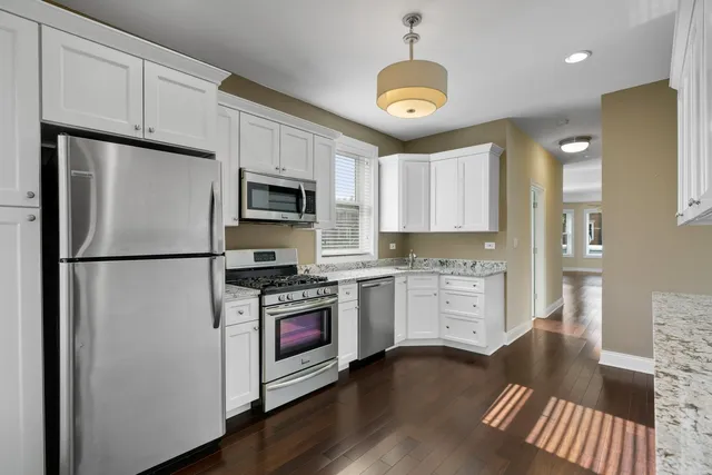 a bedroom with a bed and the wall painting