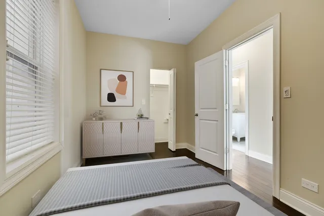 a living room with furniture and a dining table