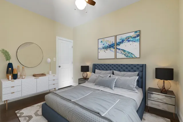 a bedroom with a bed and a dresser