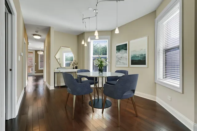 a living room with a baby crib furniture and a window