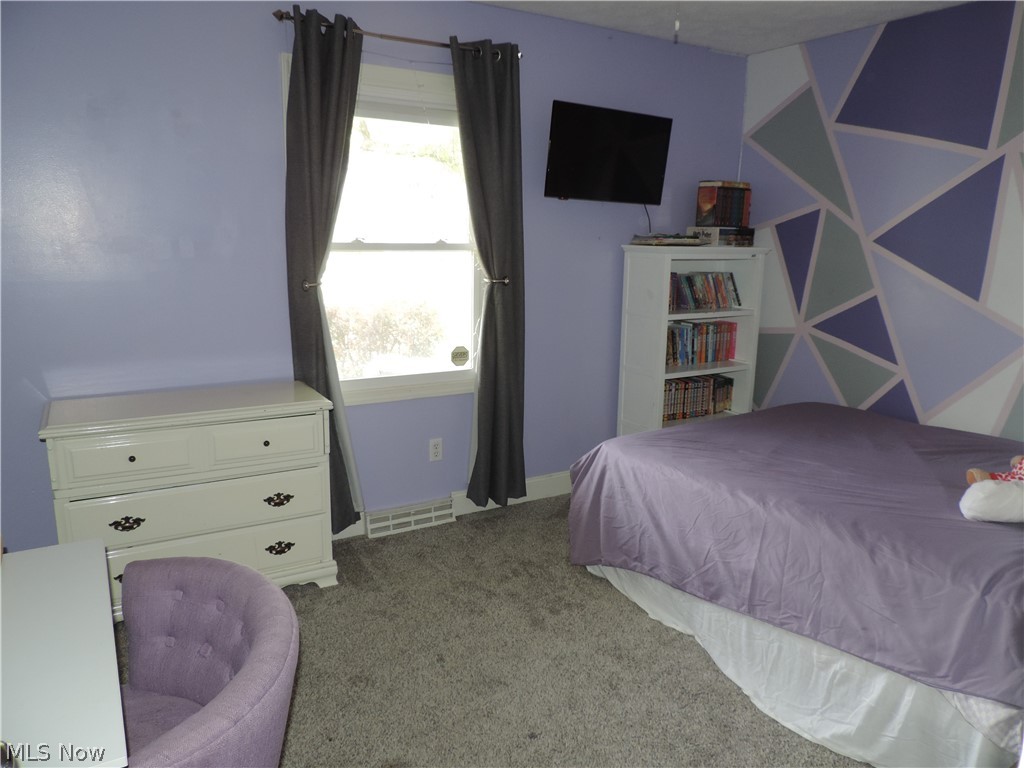 24770 Maple Ridge Road Westlake, OH 44145 - Photo 16 of 26 Bedroom with carpet floors and multiple windows