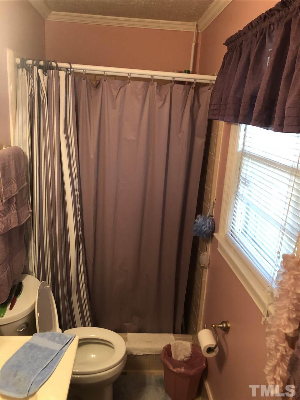 308 Shellum Street Raleigh, NC 27610 - Photo 14 of 16 a bathroom with a sink and toilet