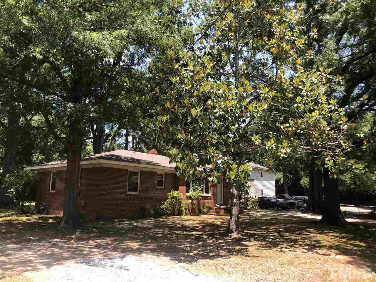 308 Shellum Street Raleigh, NC 27610 - Photo 3 of 16 a front view of a house with a yard