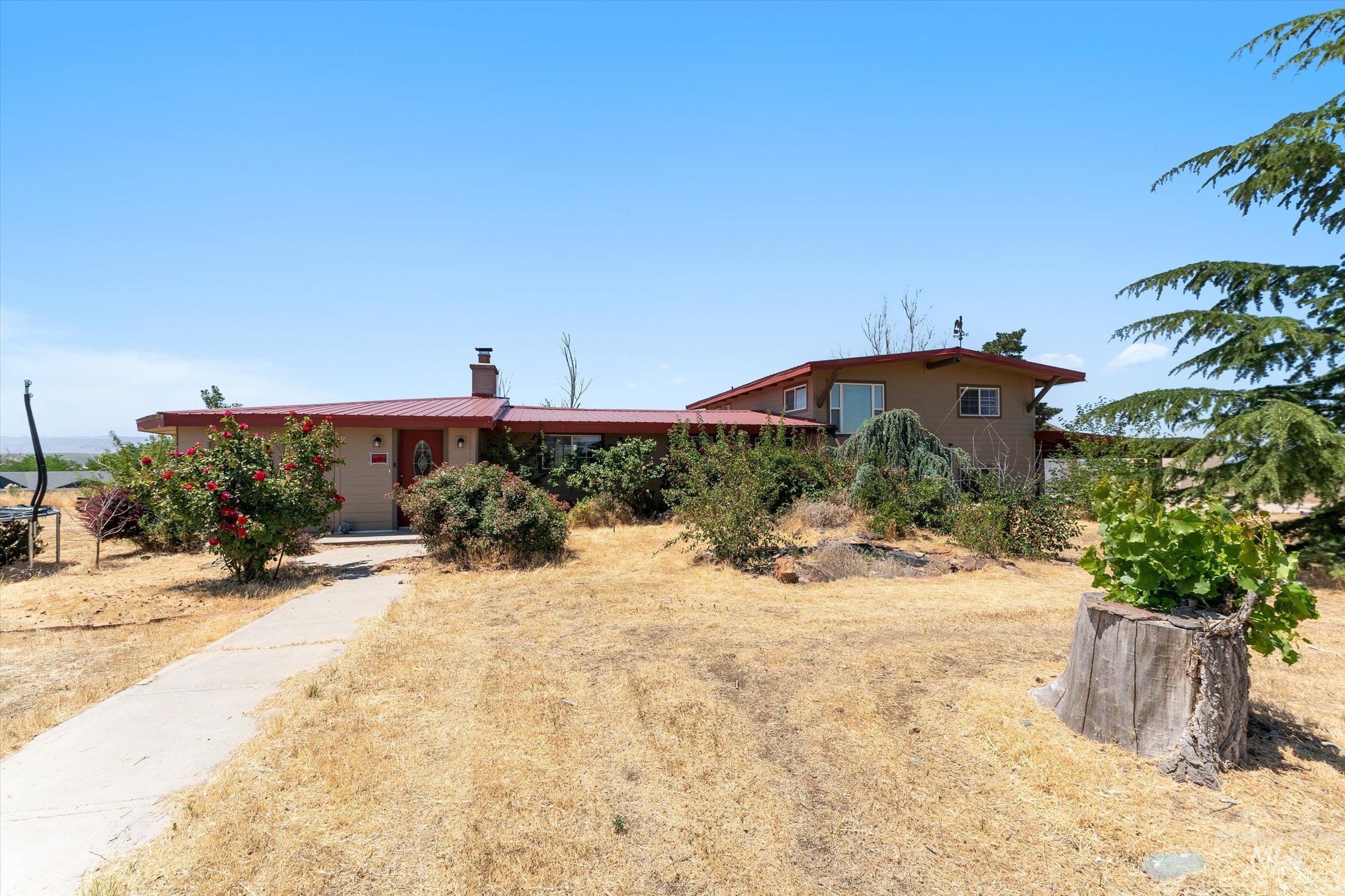 View of front of house featuring a chimney